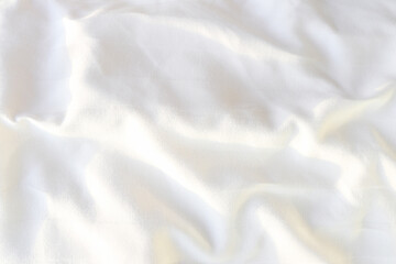 Abstract white fabric texture background. Wave soft fabric. Creases of satin. Silk.