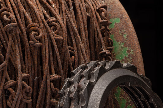 Rusty wire, john deere green patina with metal gears and close up macro of rusty steel bolts and paint