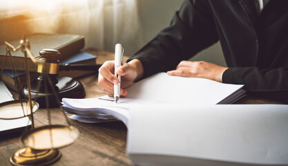 Law theme, mallet of the judge, law enforcement officers, evidence-based cases, and documents taken into account..