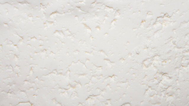 Cottage cheese homemade rustic background top view.The texture of cottage cheese.