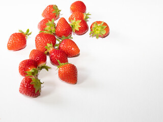 Strawberry fruit with strawberry leaf isolated on white background.