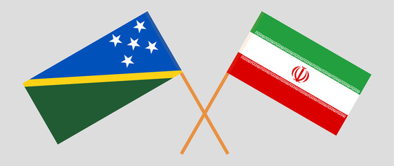 Crossed flags of Solomon Islands and Iran. Official colors. Correct proportion