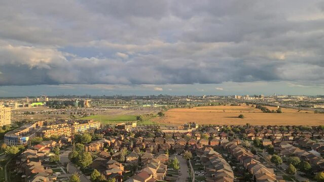 Toronto Canada Ontario time lapse aerial view above rural farmland residential housing estate countryside rooftops