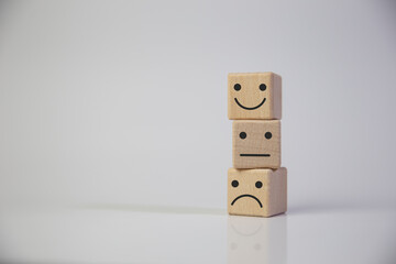 Wooden cube block stacking with icon face, The best excellent business services rating customer experience, Satisfaction survey concept