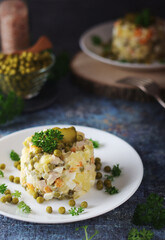 Olivier salad, traditional Russian dish, served on the plate