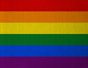 Pride colors overlaid on linen texture.