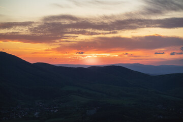 Fototapeta na wymiar Beautiful sunset over the green hills. High quality photo.