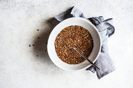 Overhead view of a bowl of organic flax seeds