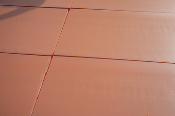 PS styrofoam insulation board fits snugly on the floor. building background, the concept of heat saving and energy saving
