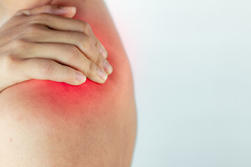 Man suffering from pain in shoulder,pain in the human body, closeup