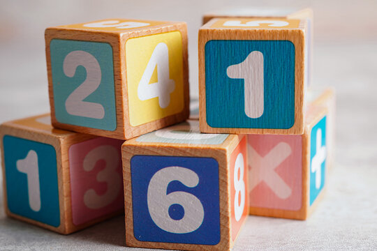Math number colorful on wooden background, Education study mathematics learning teach concept.