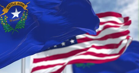 The Nevada state flag waving along with the national flag of the United States of America