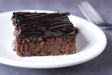 slice of brownie on plate on table 