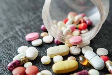 Close up of many colorful pills and capsules 