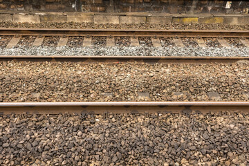 close up steel railway tracks and sleepers