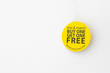 buy one get one free yellow button on white background