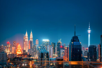 Cityscape of Kuala lumpur city skyline at night in Malaysia.