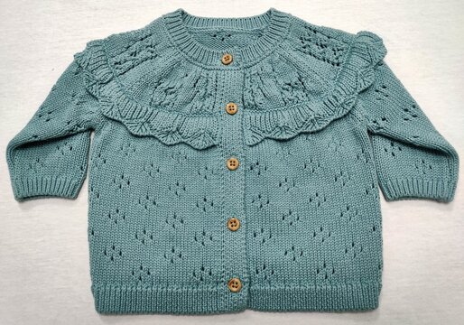 Knitted Sweater and jumper. Girls pointelle frill design knitted warm sweater, the colour combination of a beautiful sweater has nice match on the light grey background. Best quality.