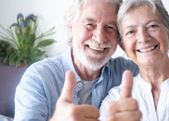 Close up portrait of beautiful happy caucasian senior couple of grandparents, looking at camera...