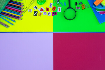 Back to school - colorful background, pencils, notebooks, scissors and accessories - education concept, copy space
