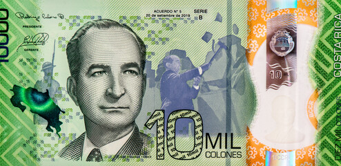 José Figueres Ferrer with himself pictured in the background abolishing the Costa Rican Army. Portrait from Costa Rica 10 000 Colones 2019 Banknotes.