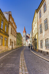 Fototapeta na wymiar Colorful street leading to the Nicholas Church in Znojmo, Czech Republic