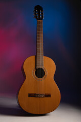 Naklejka premium Classical guitar on a colourful background