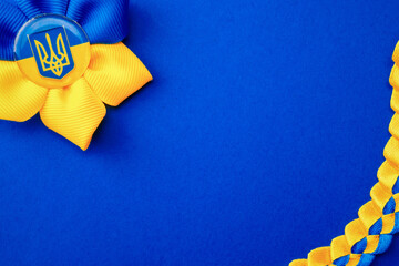 Ukraine symbol blue background. Ukrainian flower trident symbol isolated on blue. Solidarity Ukraine concept.