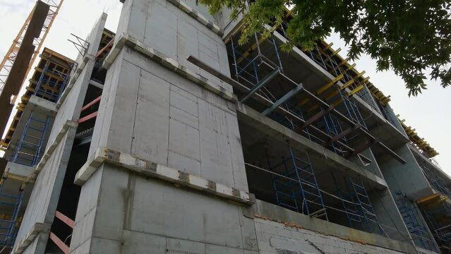 House building process. Home construction zone. Exterior builder work. Safety development. Outdoor constractor. Industrial infrastructure. Site background