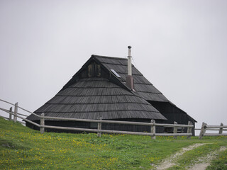 View of traditional Shepard cottage in the valley and the misty sky in the background, Velika...