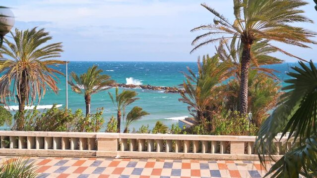 Mediterranean sea coast in Sanremo, Italy. Embankment street with a lot of greenery