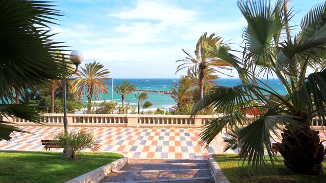 Mediterranean sea coast in Sanremo, Italy. Embankment street with a lot of greenery