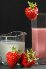 Traditional ayurvedic healthy drink with strawberries of yogurt and ice cube with drinking