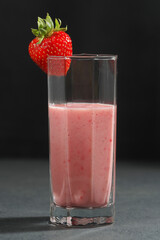 Traditional ayurvedic healthy drink with strawberries of yogurt and ice cube with drinking