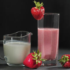 Traditional ayurvedic healthy drink with strawberries of yogurt and ice cube with drinking
