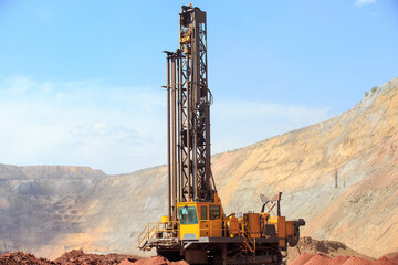 Machine for drilling wells in the quarry. Drilling of boreholes for laying an explosion in a...