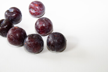 Fresh plum fruit isolated on white background