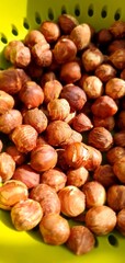 Peeled nuts lie in a colander. Hazelnut. Proper nutrition, healthy nutrition. Focus in the center of the frame.