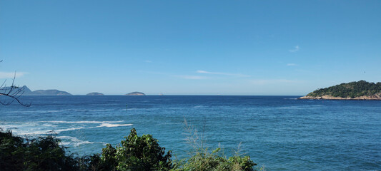 Fototapeta premium stone granite mineral hill wall cliff island forest sea ocean beach wave foam water blue sky leaf bush tree flower fruit horizon high landscape rio de Janeiro travel freighter ship vessel cargo contai