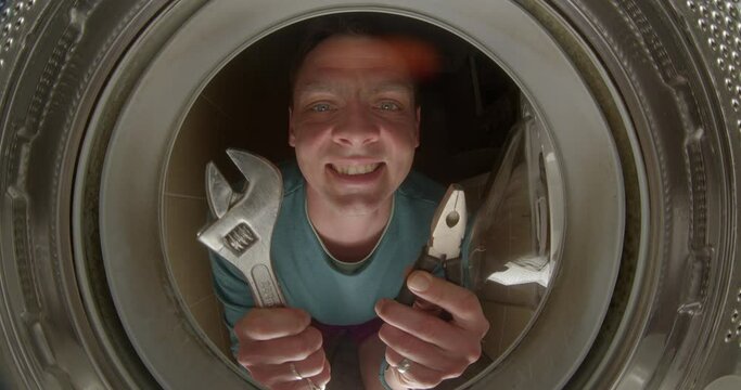 Video blogger Services as a handyman, housekeeping and personal helper. Man with tools hands tells tips repairing household appliances looking camera. Husband for an hour repair service. 