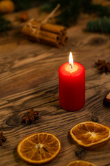 Traditional Czech Christmas on wood decoration with twig, candle, apple, orange, fruit