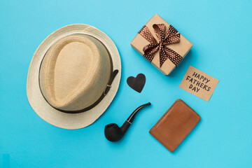 Happy Father's Day inscription with different gifts on color background, top view