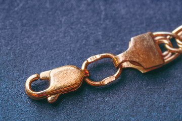 Gold 585 stamp. Gold clasp of a golden bracelet with hallmark 585. It is a type of gold, known as...
