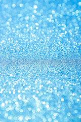 Abstract blue trendy backdrop. Sparkling background made of lights. Festive blurred backdrop