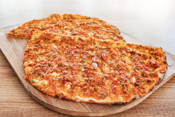 Lahmacun - is a traditional turkish cuisine - baked in oven pita bread with minced meat and spices. This dish is included in unesco intangible heritage