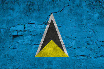 Patriotic cracked wall background in colors of national flag. Saint Lucia