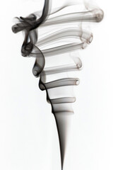 Puffs and curls of dark smoke on a white background rising from a burning stick