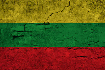 Patriotic cracked wall background in colors of national flag. Ghana