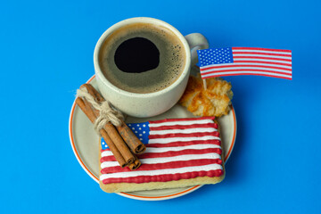 home baking patriotic cookies icing like american flag and cup of coffee. patriotic background for...