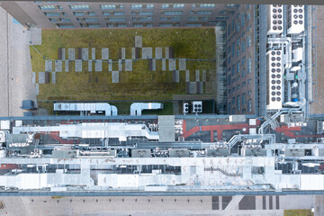 Fototapeta premium Air conditioning system on the roof of the building, advanced air conditioning and ventilation system, aerial view down the roof of the house, many different ventilation ducts
